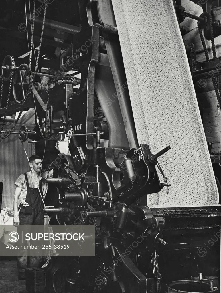 Vintage photograph. Printing machine in British cotton factory that prints a five color design on cotton cloth at high speeds