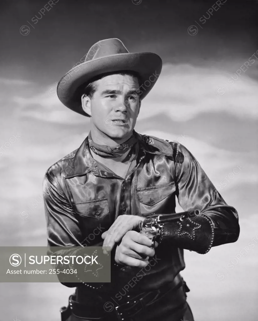 Close-up of a cowboy holding a pistol