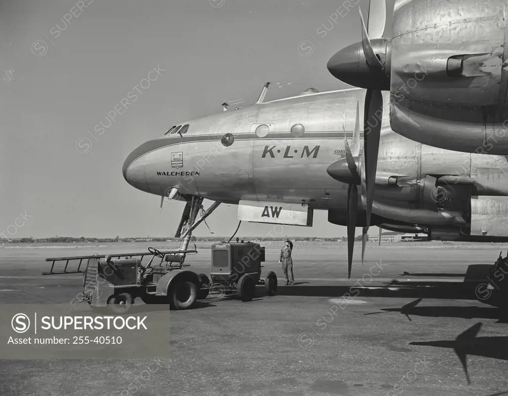 Vintage photograph. Starting and warming engines of constellation overseas airliner, of the KLM Dutch Airlines, in preparation for flight overseas.