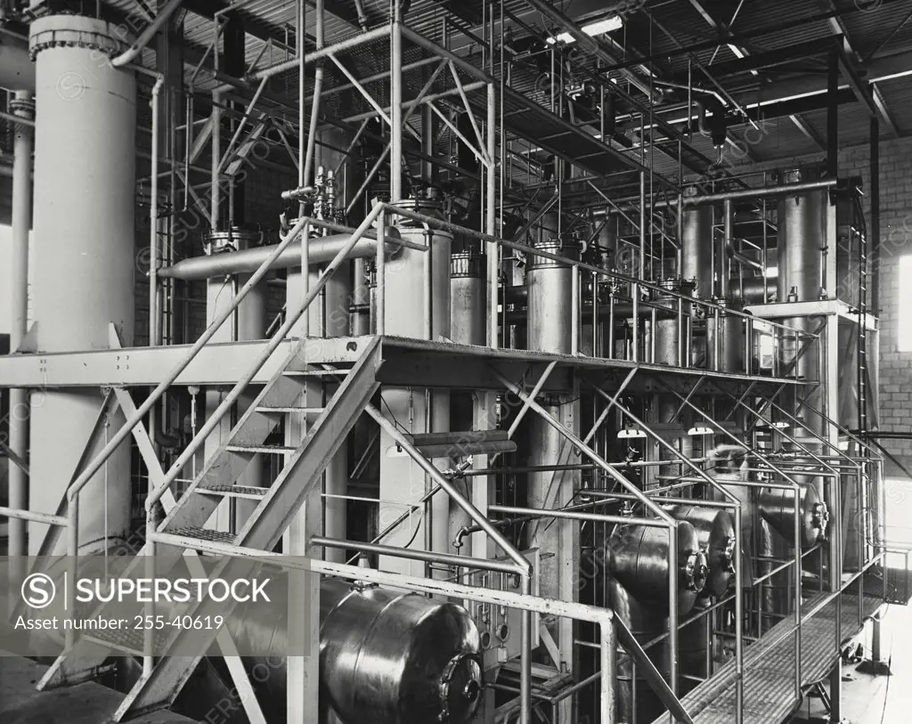 Vintage photograph. Retorts and compressors used in producing quick frozen orange juice