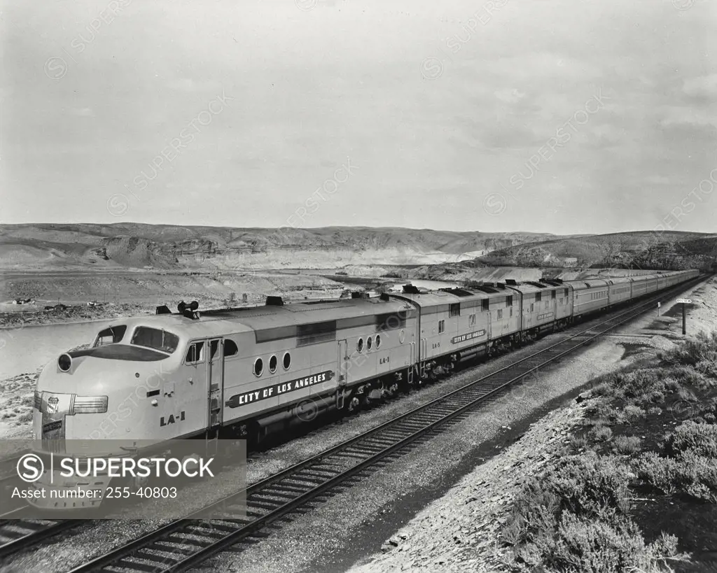 Vintage photograph. Locomotive rolling through desert