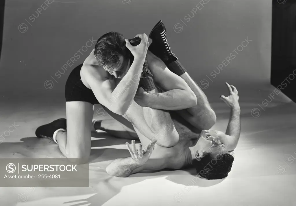 Vintage Photograph. Two wrestlers trying to pin each other down to ground