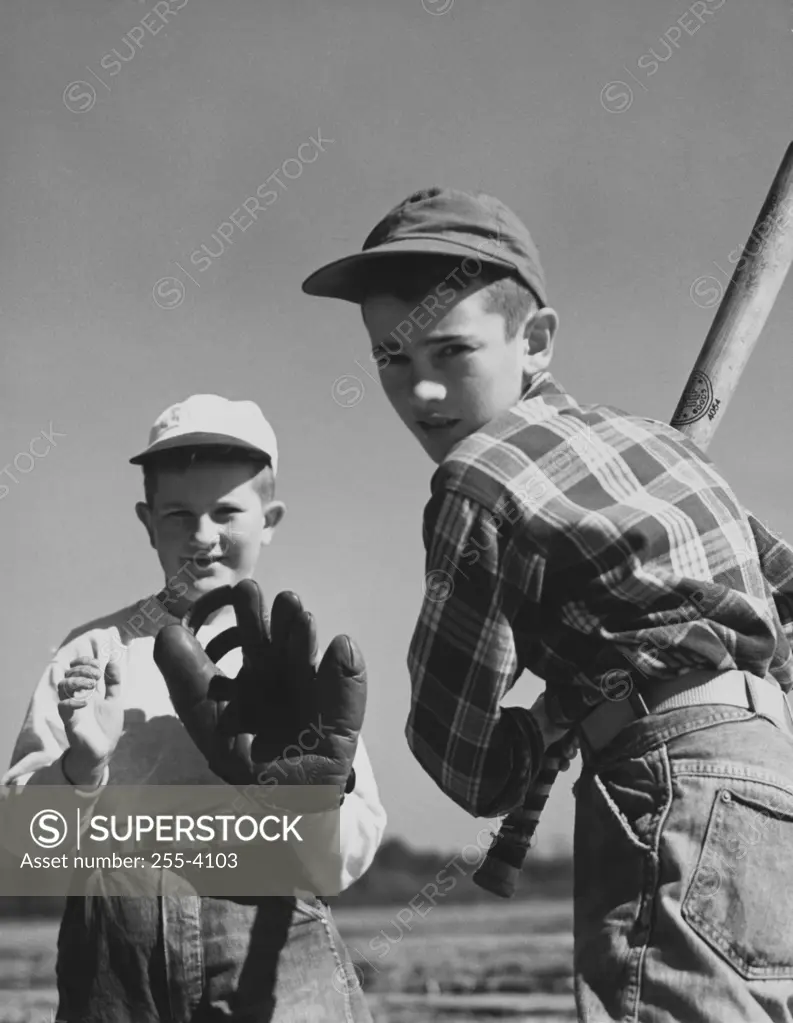Portrait of two boys playing baseball