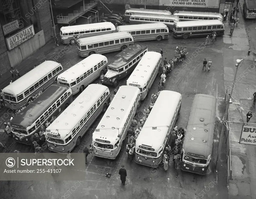 Vintage photograph. High angle view of buses parked in a bus station, New York City, New York State, USA