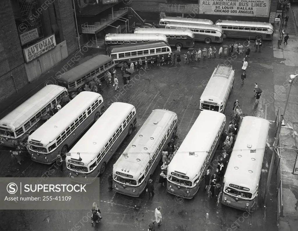 Vintage photograph. High angle view of buses parked in a bus station, New York City, New York, USA
