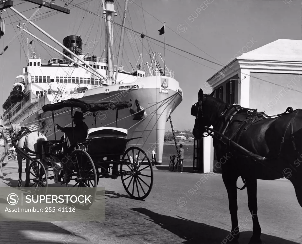 Horse cart in front of a cruise ship, SS Queen of Bermuda