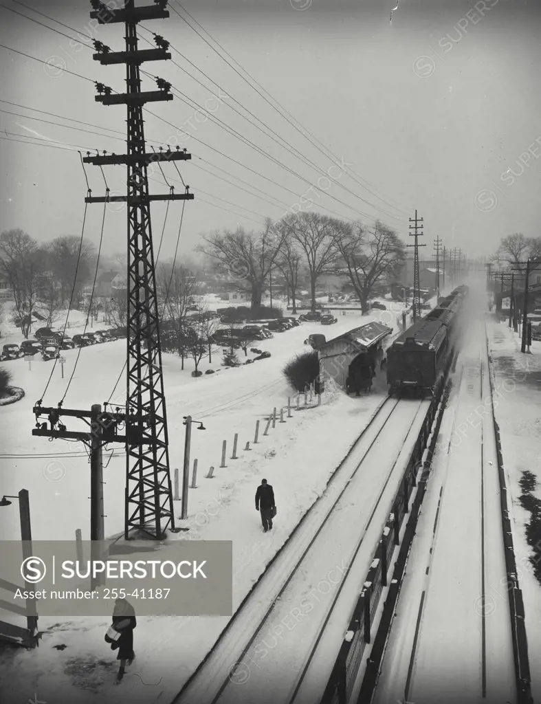 High angle view of a train on snow covered railroad track at the station in Long Island, New York, USA