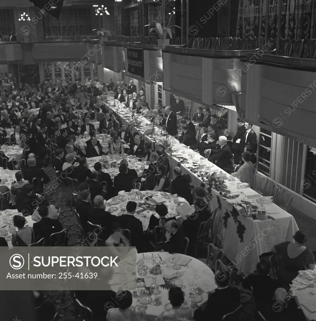 Vintage photograph. Large group of people at banquet dinner