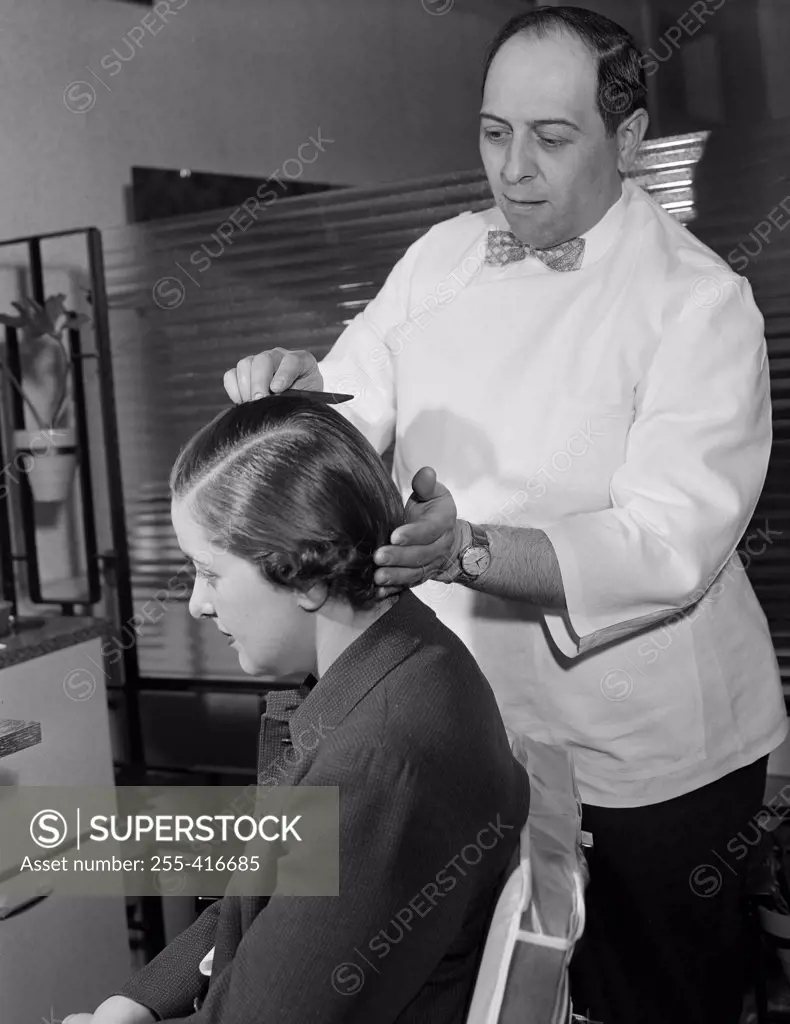 Hairdresser preparing hairstyle in hair salon