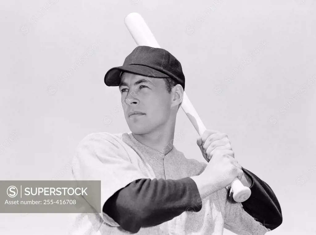 Baseball player holding bat