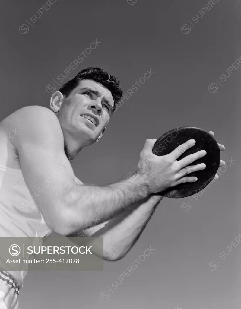 Man holding plastic disc