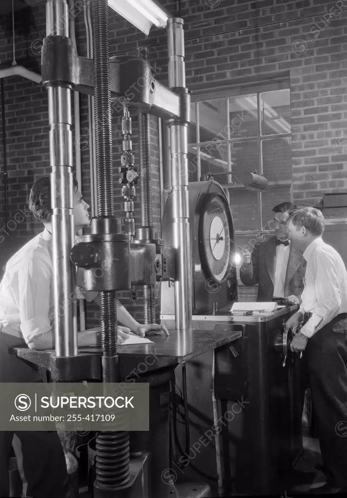 Group of men testing machines, Stevens Institute of Technology, Hoboken, New Jersey, USA