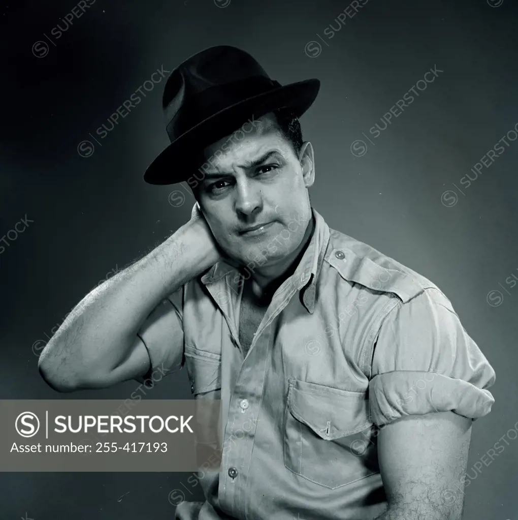 Studio portrait of man wearing hat