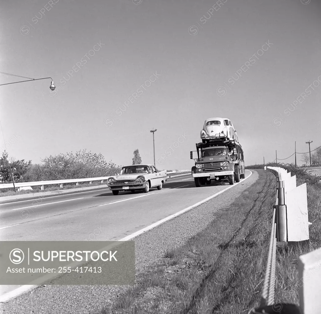 Truck with cars on road