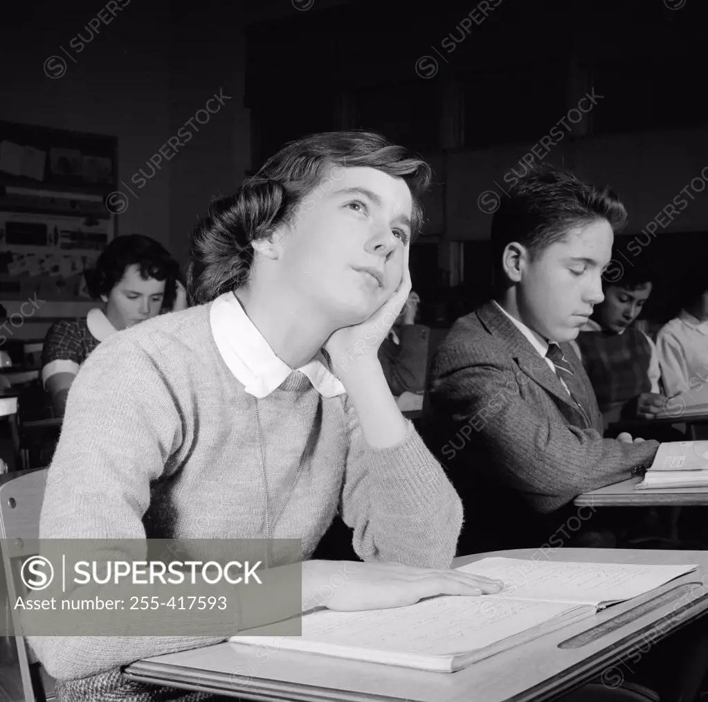 School girl daydreaming in classroom