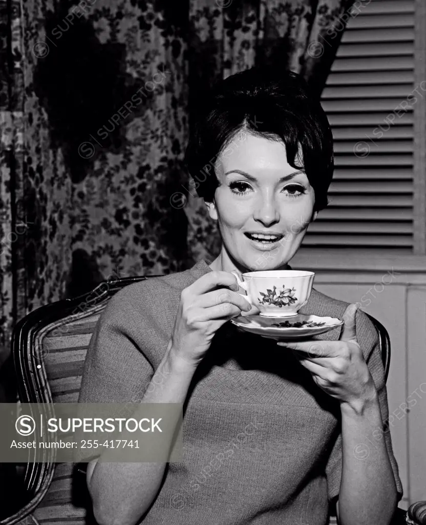 Young woman enjoying cup of tea