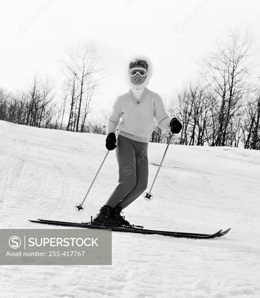 Woman in goggles skiing
