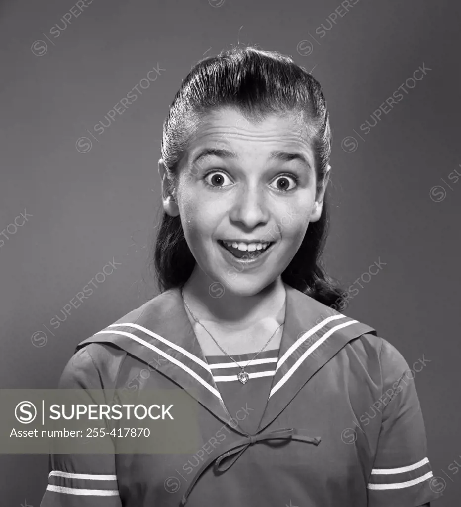 Studio portrait of surprised school girl