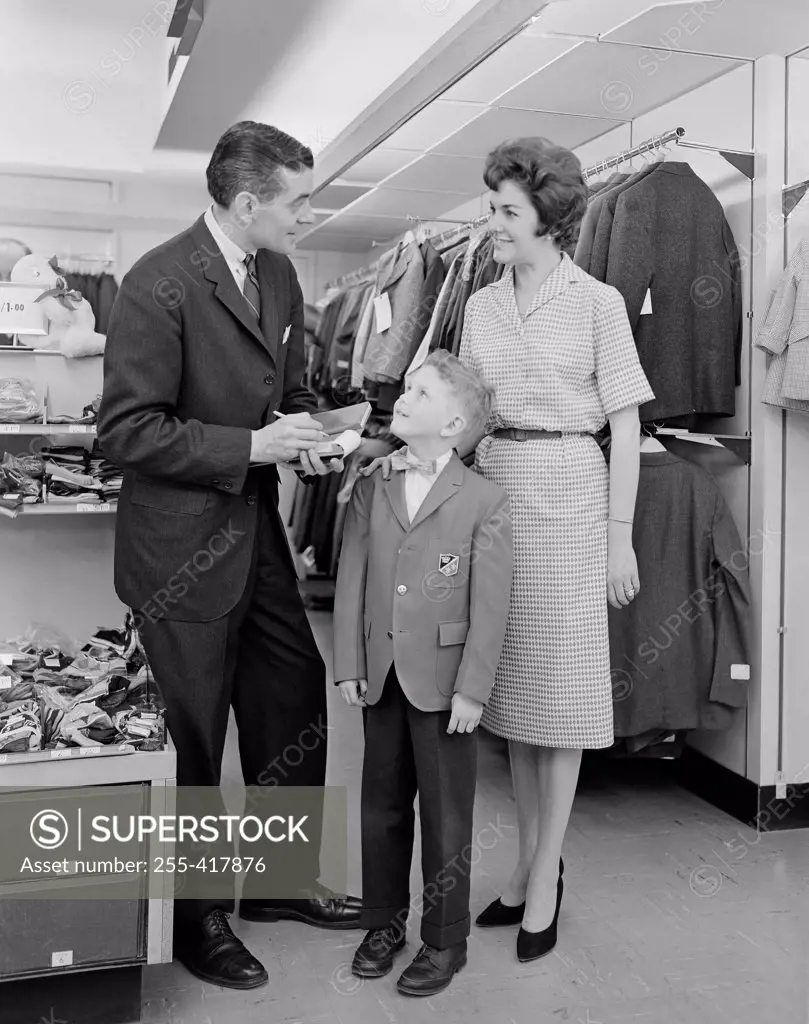 Parents with son in clothes shop