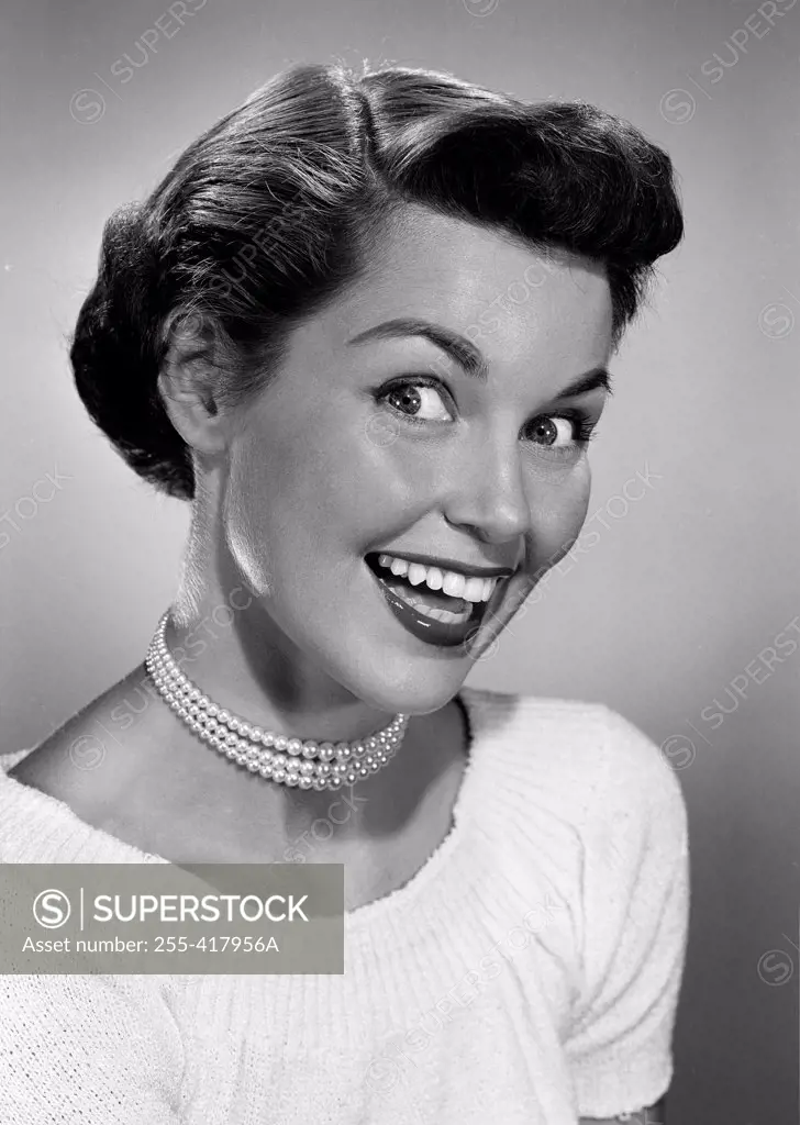 Portrait of excited young woman