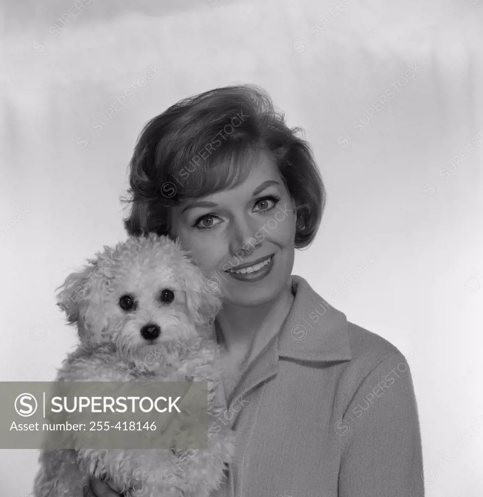 Portrait of woman with small dog