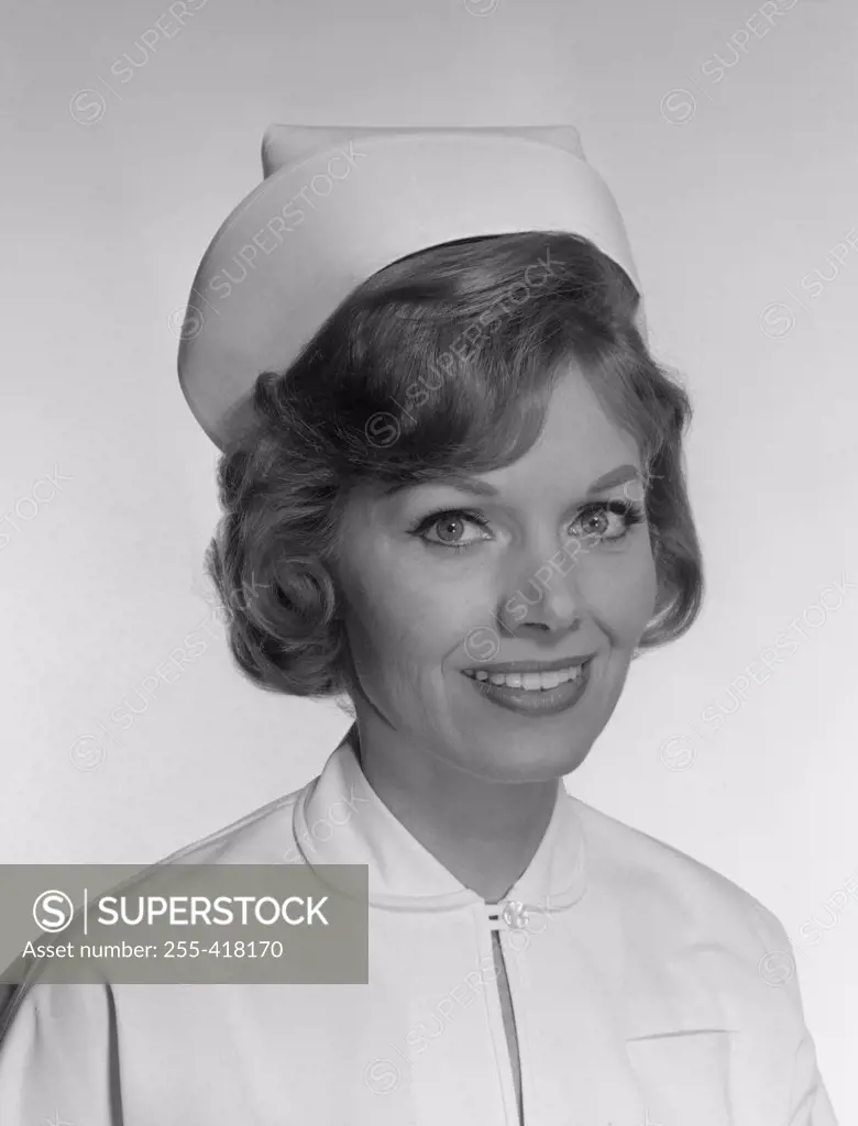 Studio portrait of smiling nurse