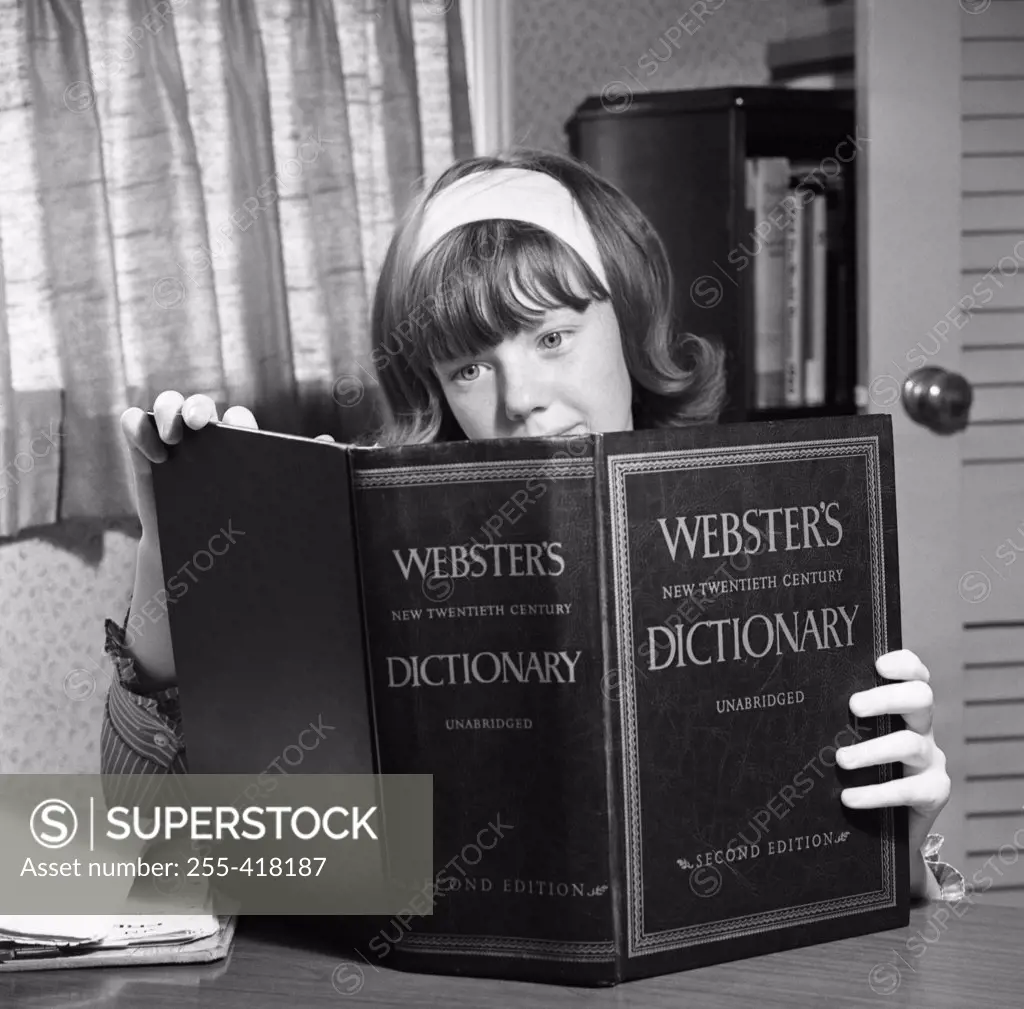 Girl studying Webster's dictionary