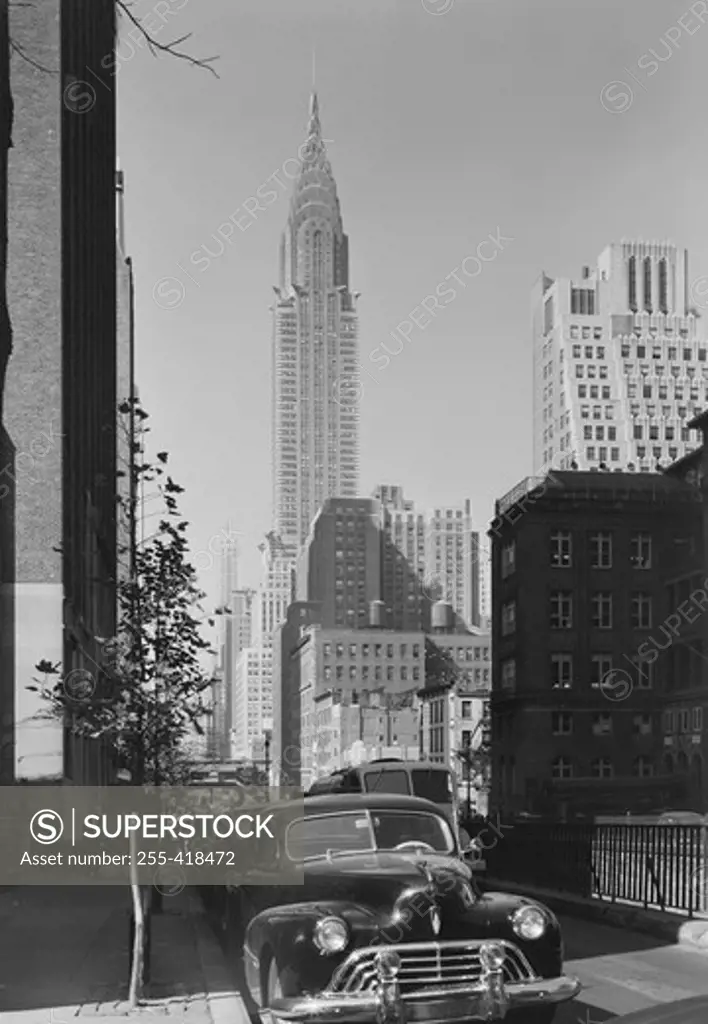 USA, New York State, New York City, Upper Midtown Manhattan, street with parked cars, Chrysler Building in the background