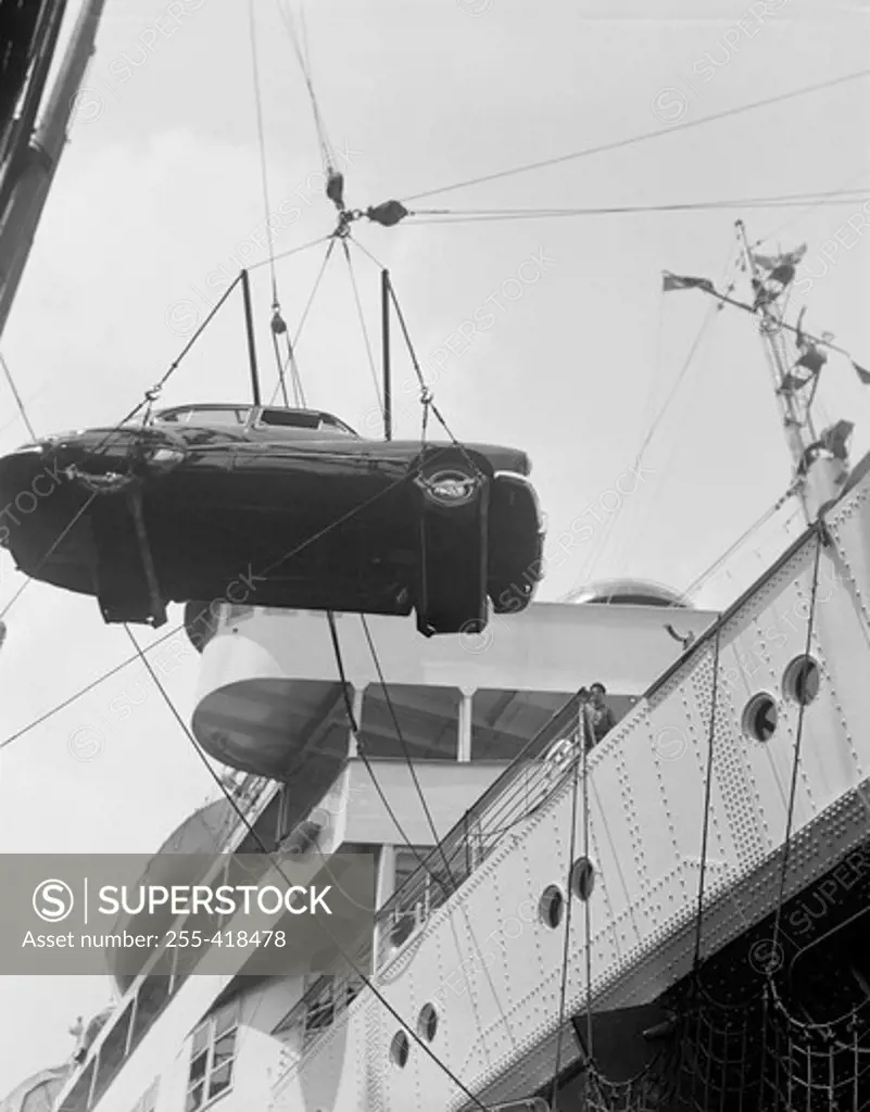 Hanging car is transporting on ship