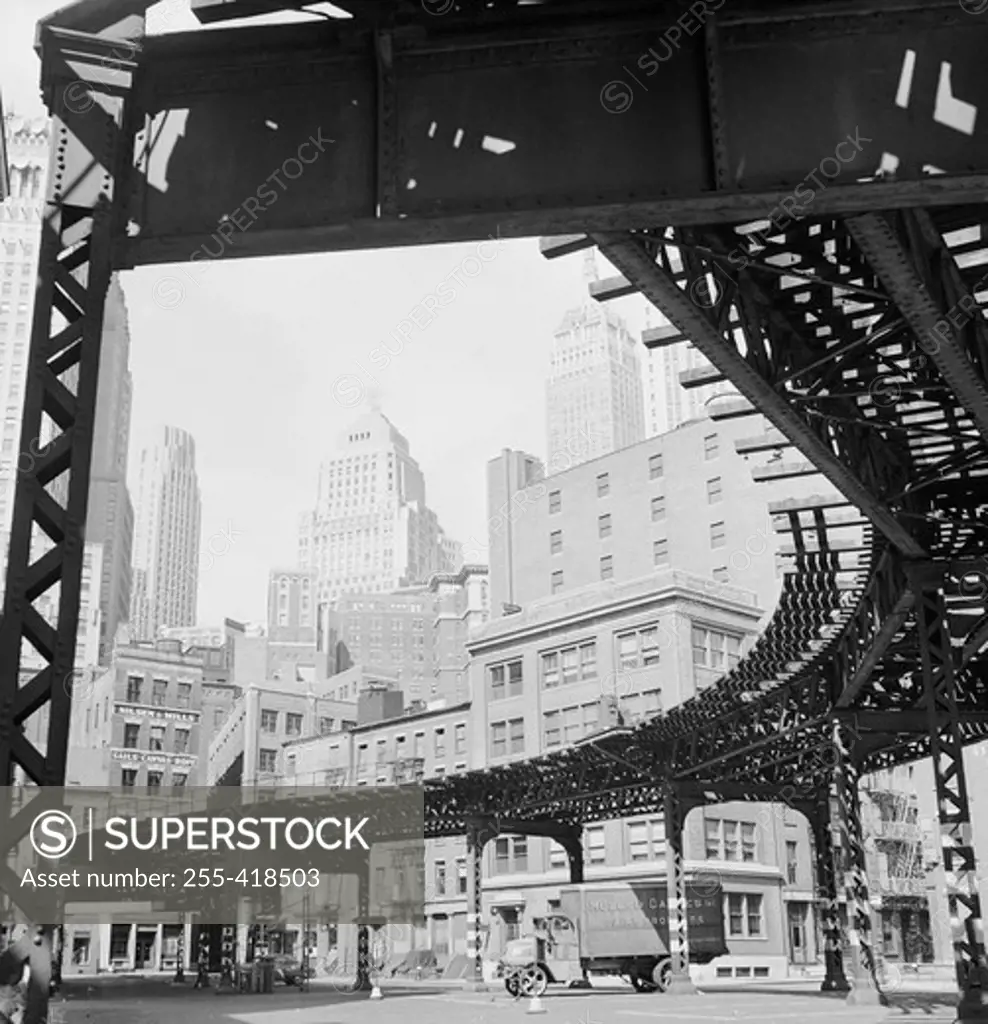 USA, New York State, New York City, Manhattan, Skyscrapers with elevated railroad track on the foreground