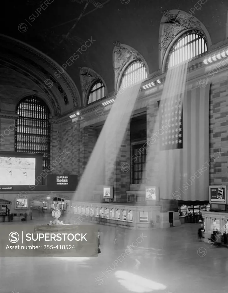 USA, New York State, New York City, interior view of Grand Central Station with rays of light coming through window