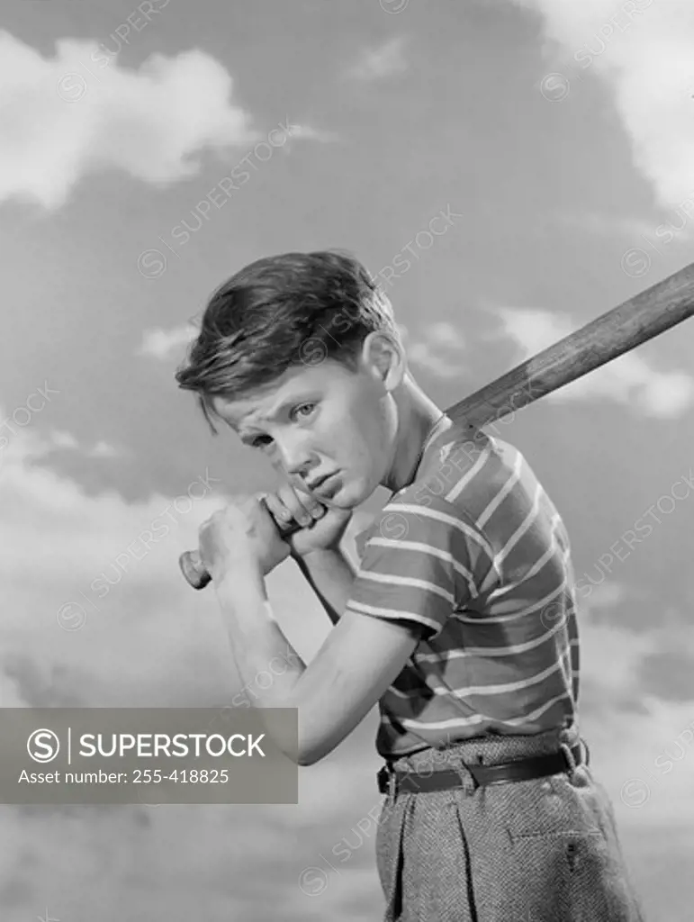 Boy playing baseball outdoors