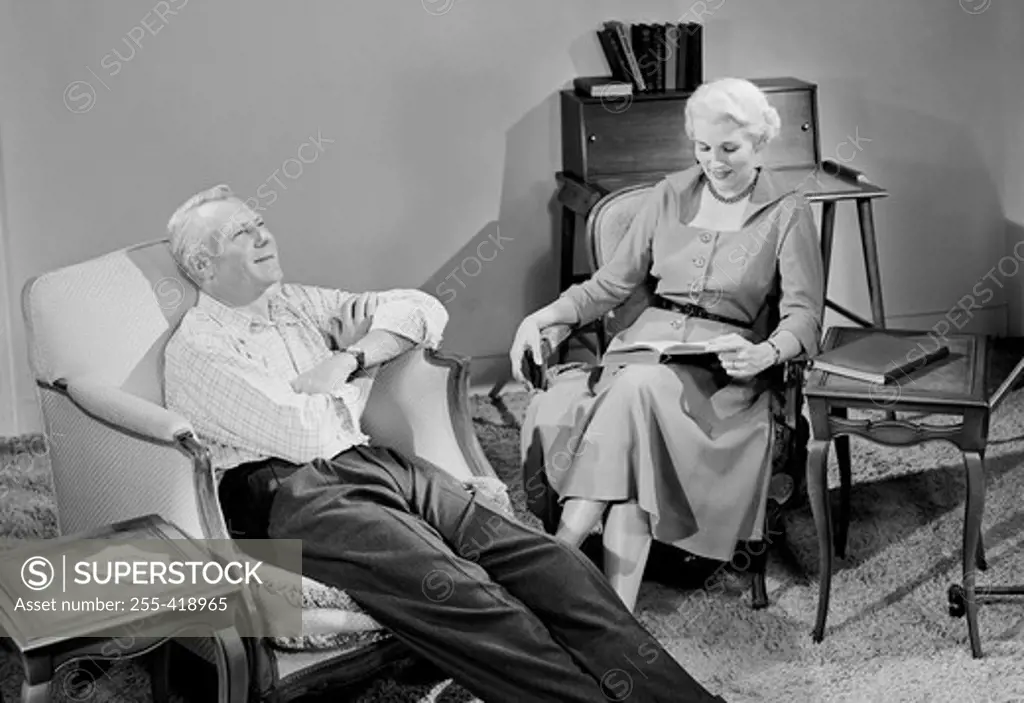 Senior couple relaxing in living room