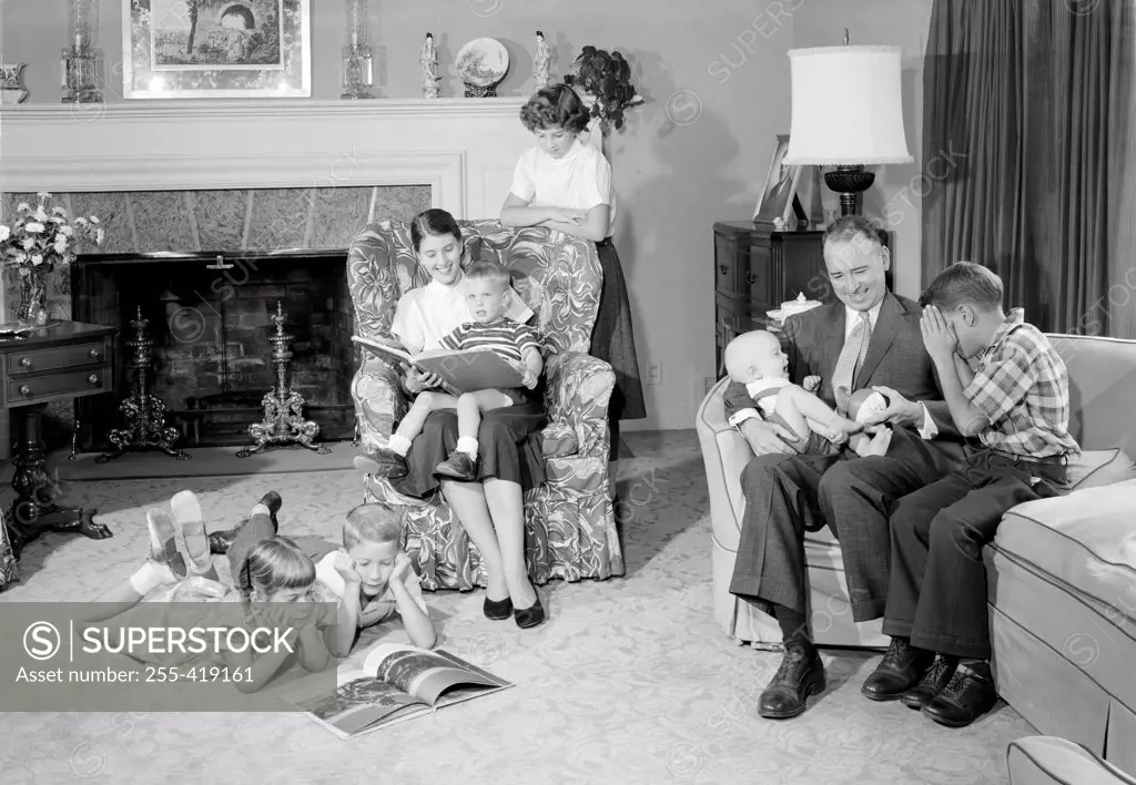 Family with six children in living room