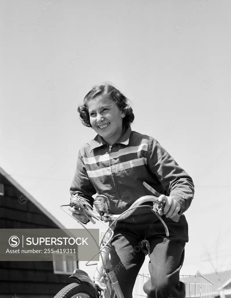 Smiling girl cycling