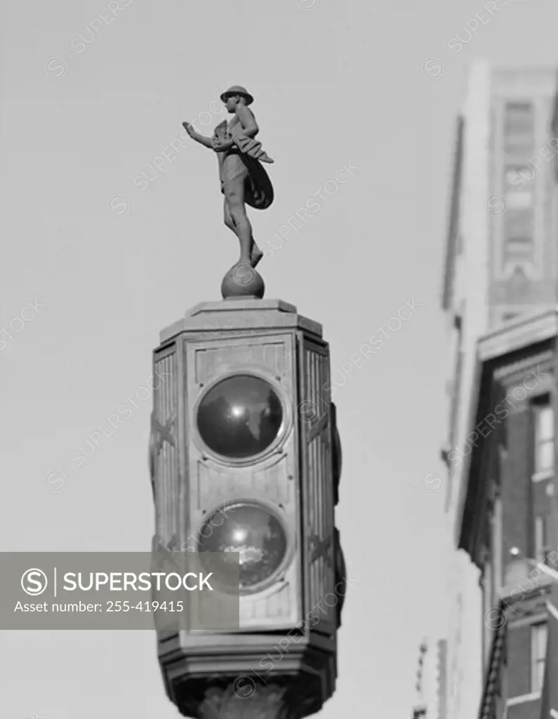USA, New York State, New York City, Figure of Mercury on the top of traffic signal light along Fifth Avenue