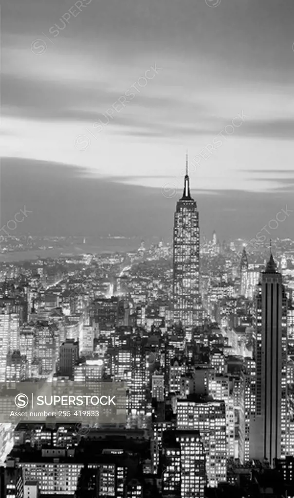 USA, New York State, New York City, Night view over Midtown and Lower areas of Manhattan with Empire State building silhouetted against the evening sky