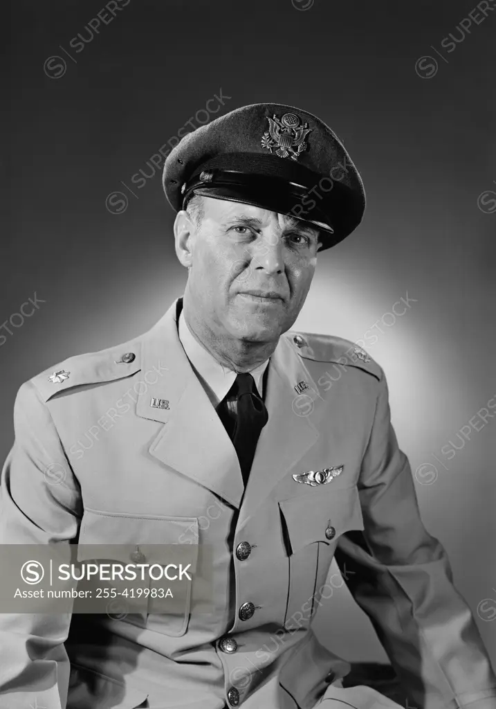 Portrait of senior man in military uniform, studio shot