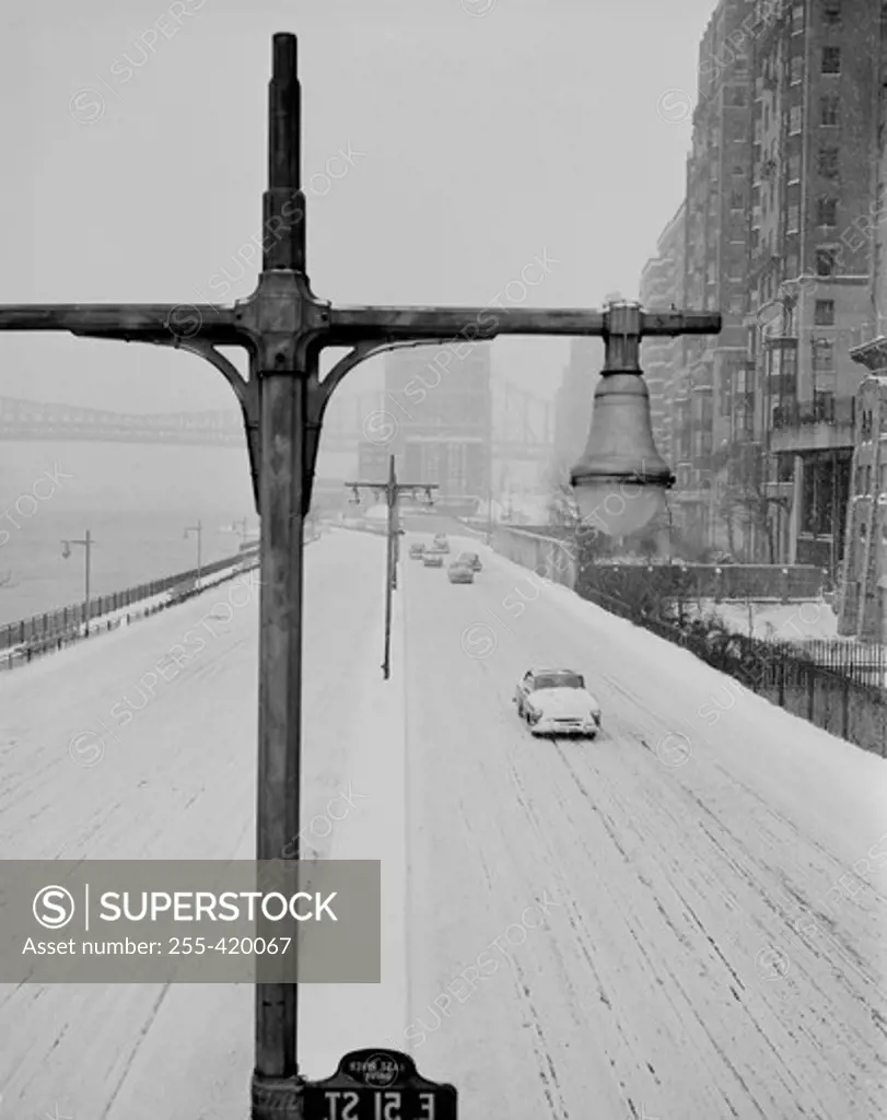 USA, New York State, New York City, snow covered East River Drive from vicinity of 50th Street