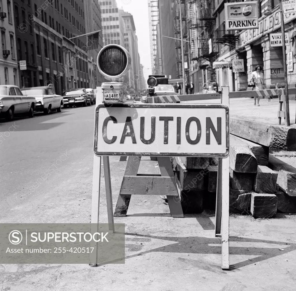 Caution sign on city street