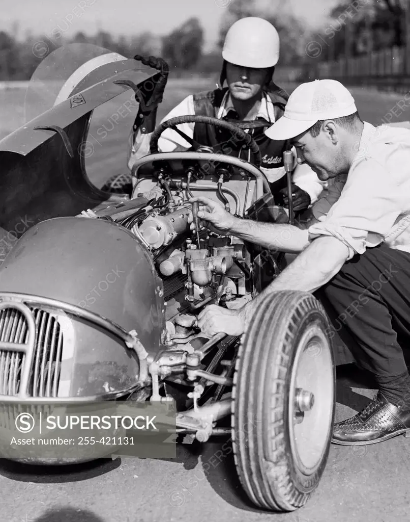 Man repairing racing car