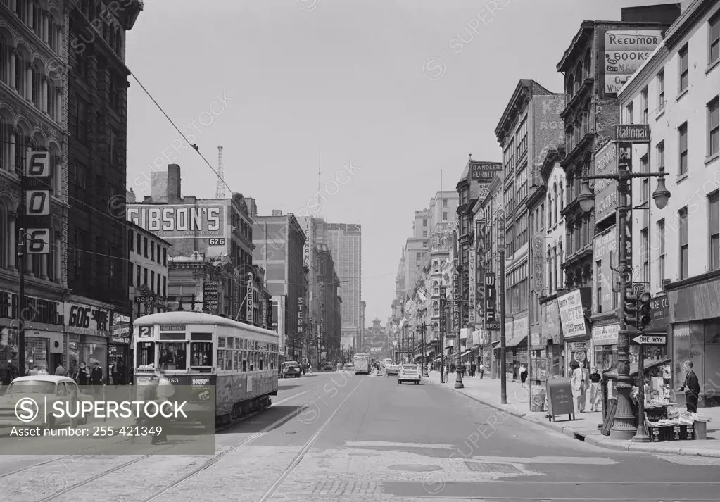 USA, Pennsylvania, Philadelphia, Pedestrians and tram on Market Street