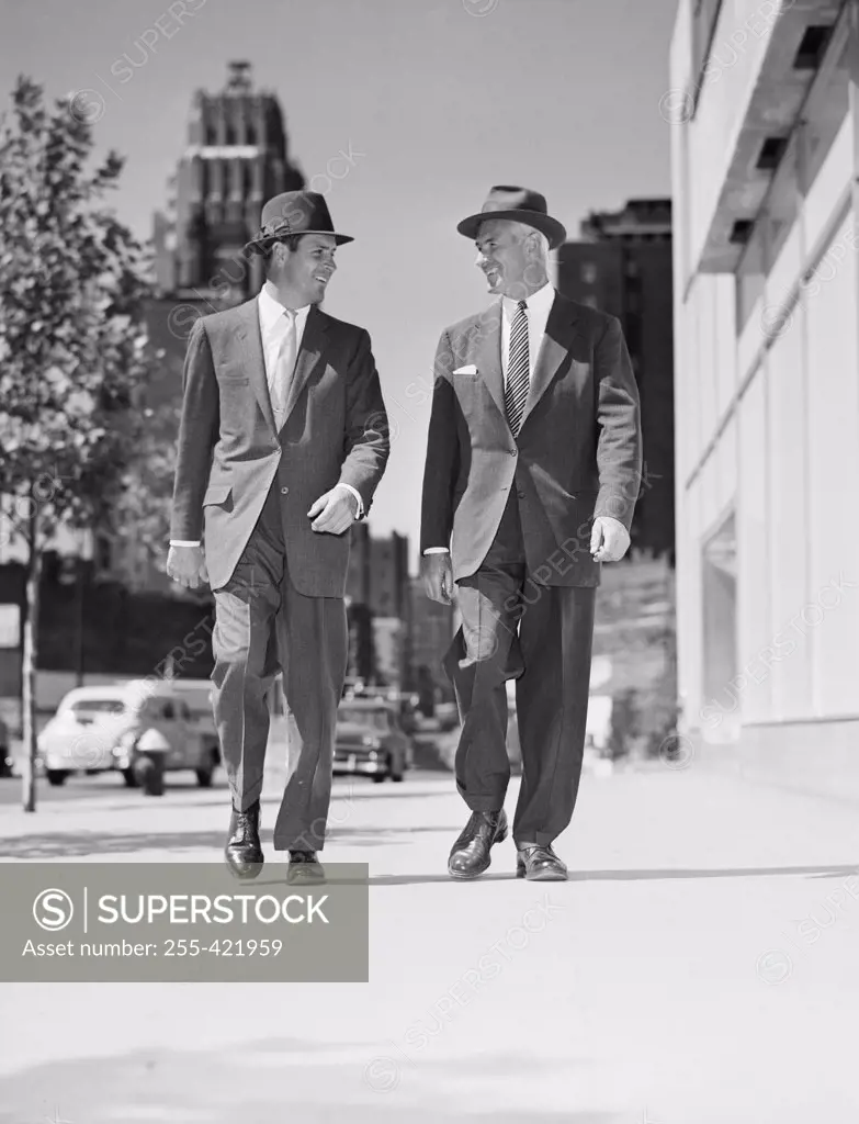 Pair of businessmen walking in downtown