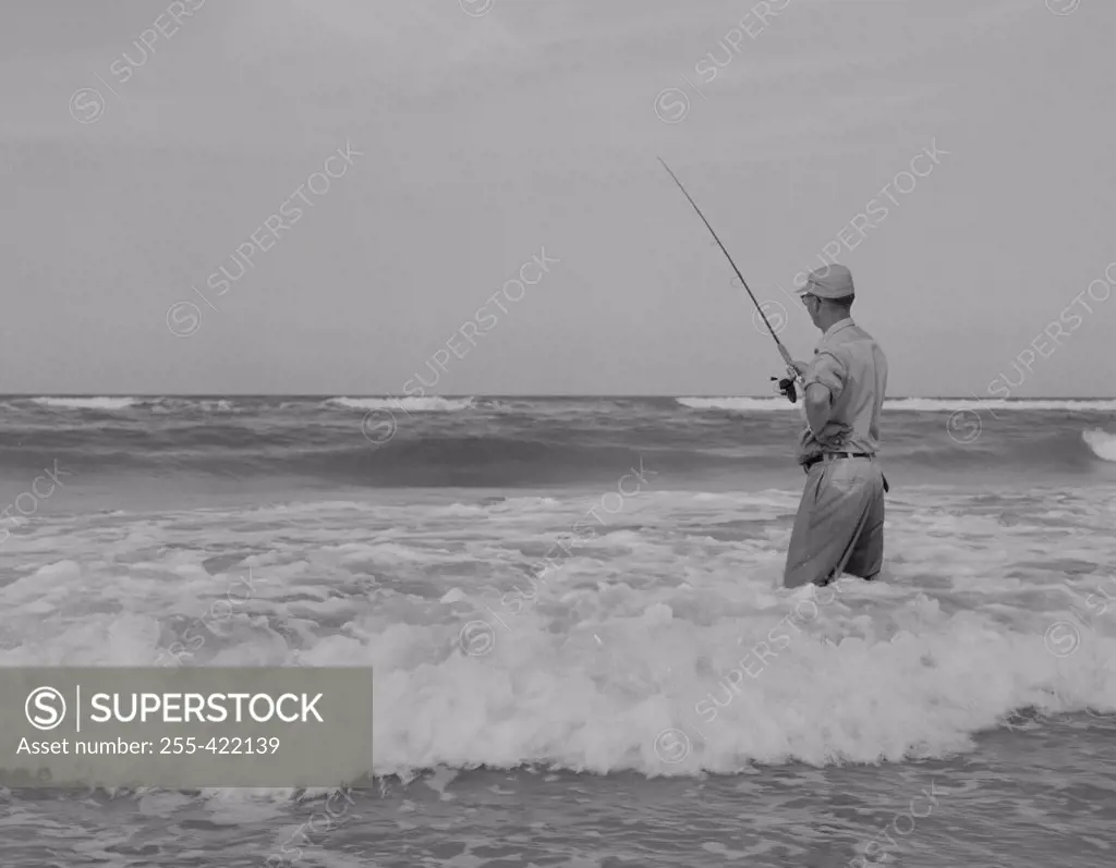 Man fishing into sea