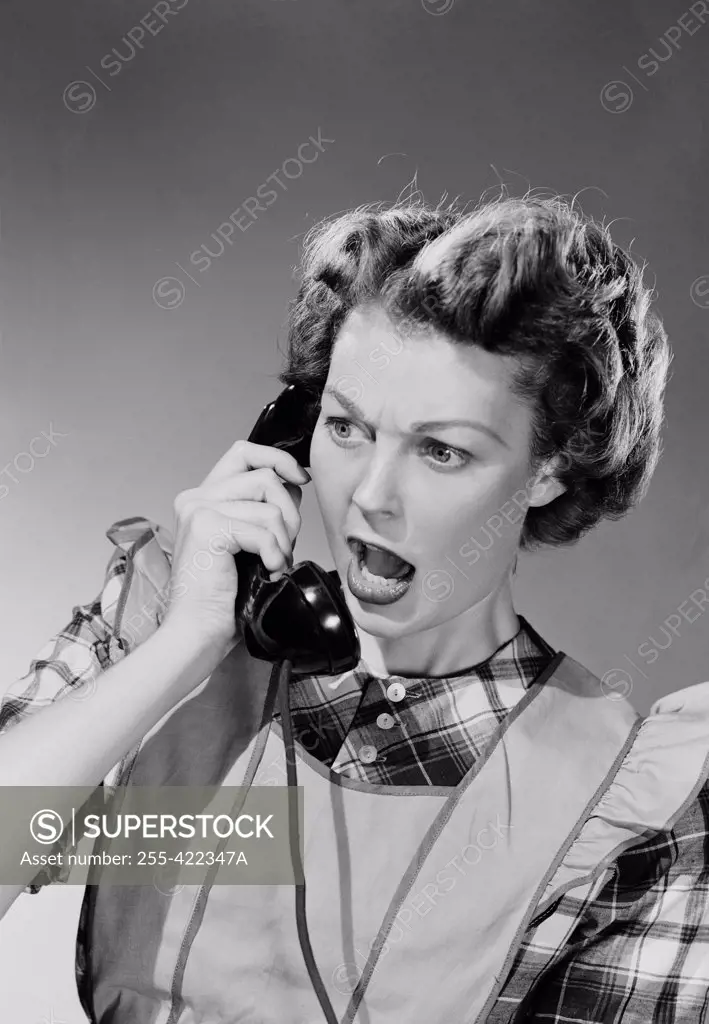 Young woman on landline phone