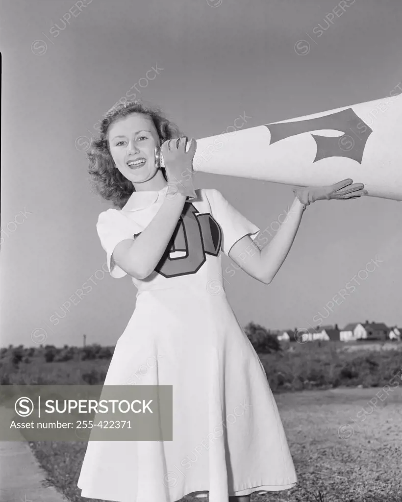 Portrait of cheerleader with megaphone