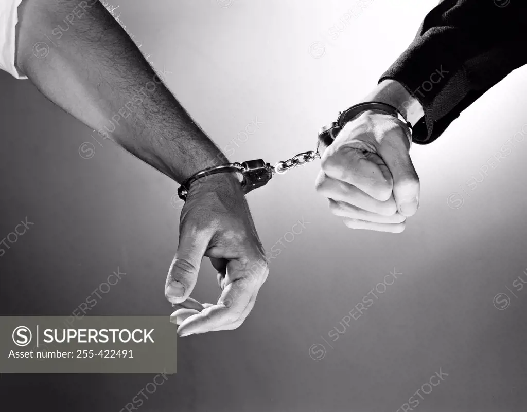 Two people handcuffed together