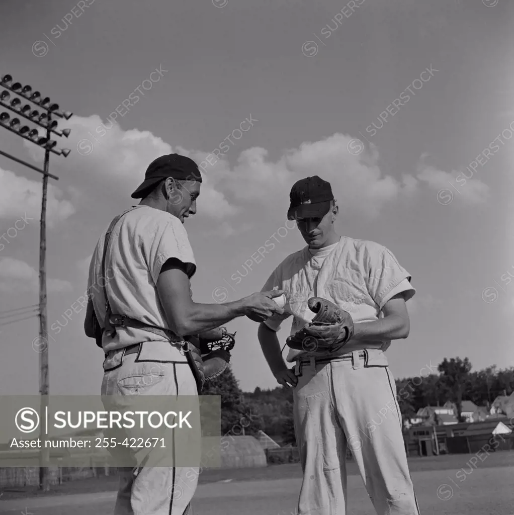 Two baseball players talking
