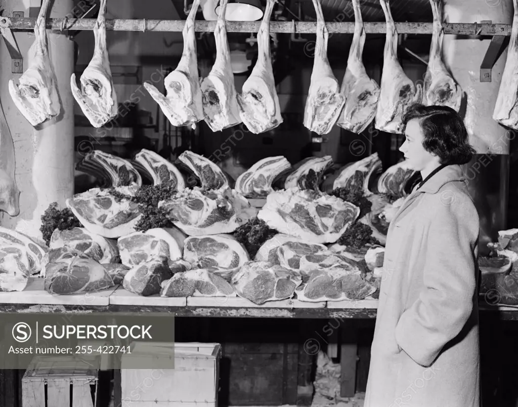 Woman in butcher's shop