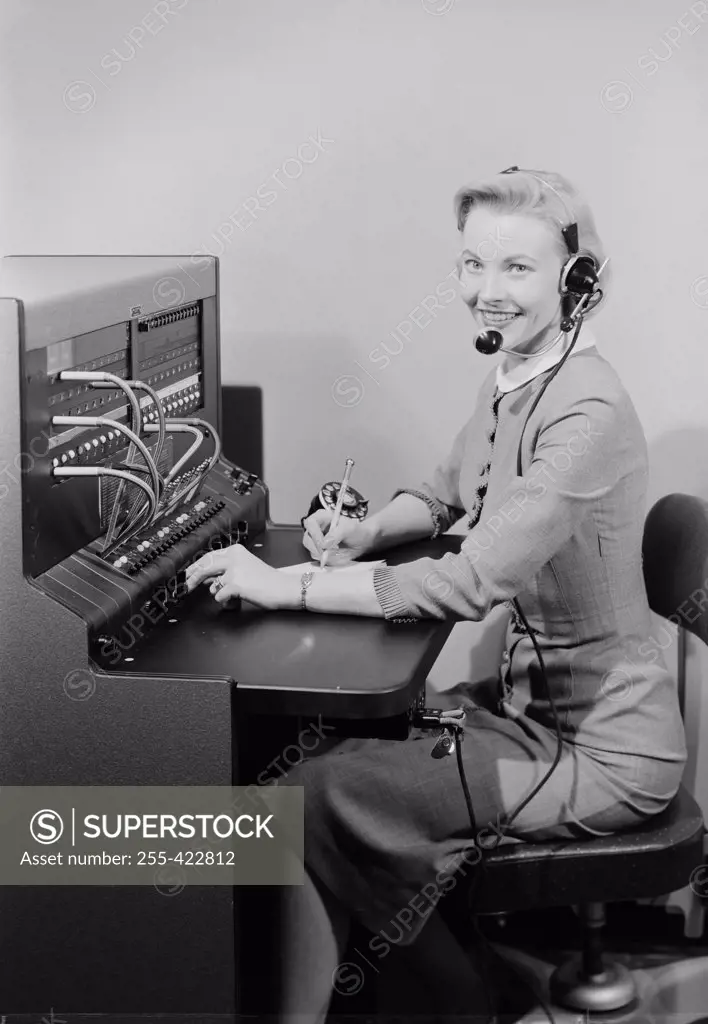 Studio portrait of telephone switchboard operator